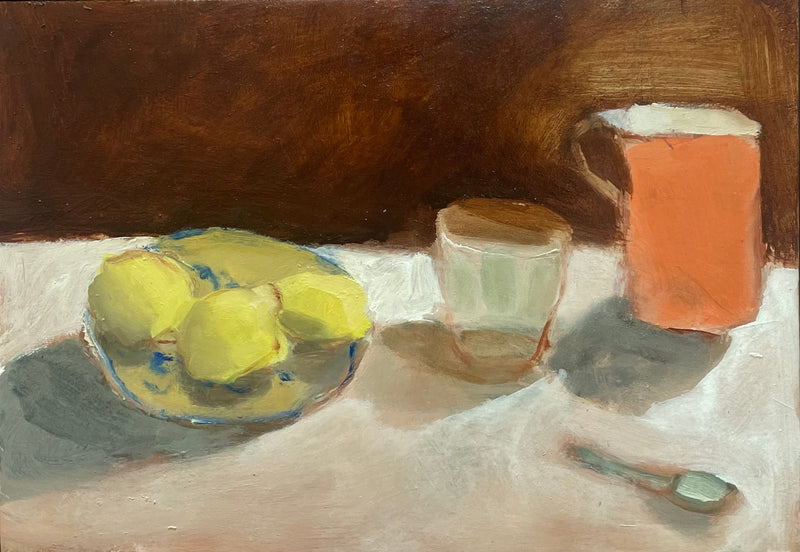 Lemons On A Plate With Glass And Orange Jug