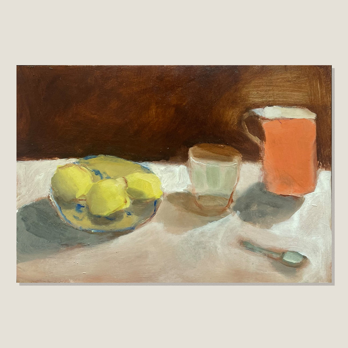 Lemons On A Plate With Glass And Orange Jug