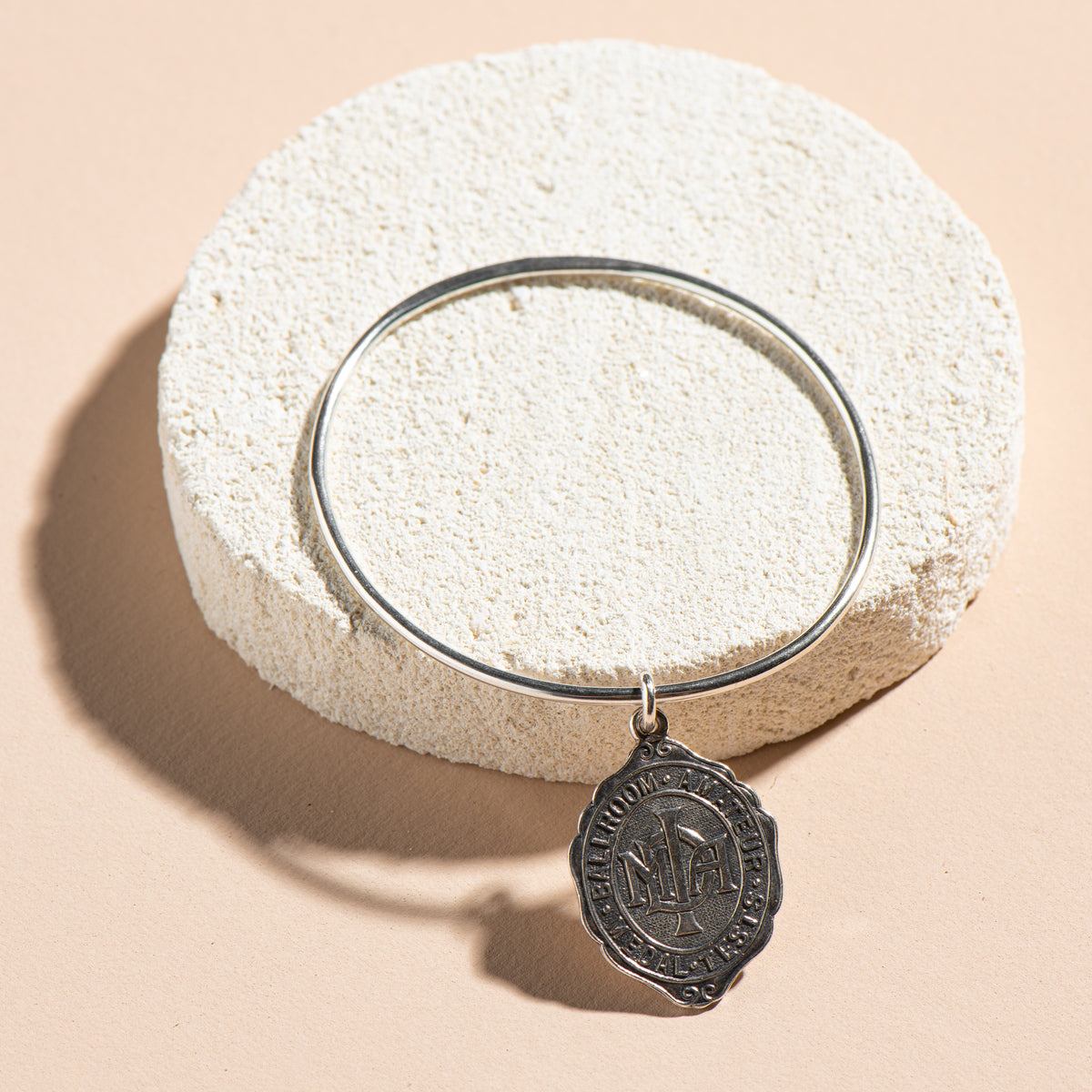 Rounded Oval Bangle with 1946 Vintage Fob Medal